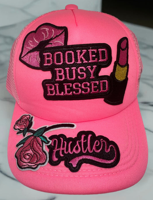 "Booked, Busy, Blessed" Pink Trucker Hat